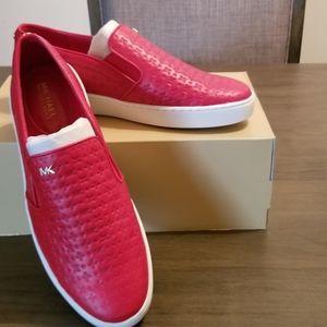 Red Michael Kors slip ons.. leather